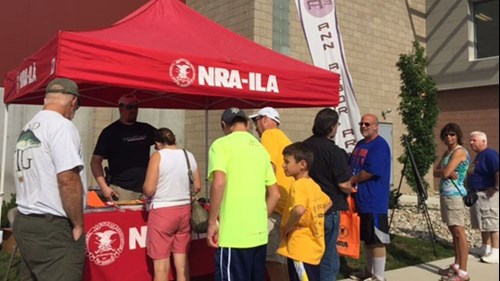 NRA Day outside under a red awning